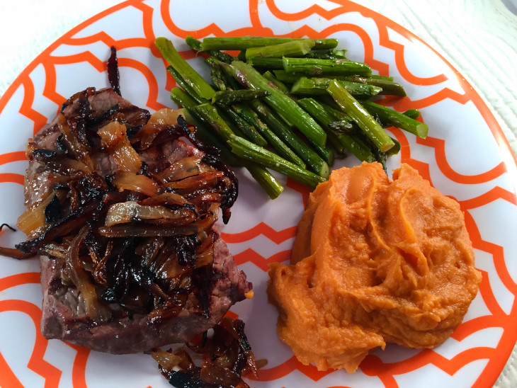 grilled steak with smothered onions